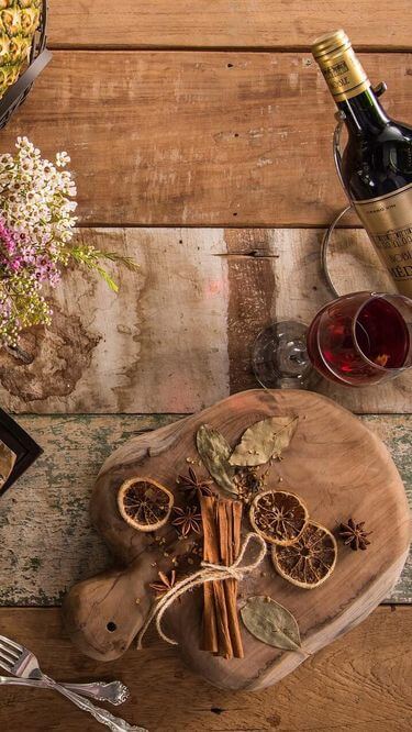 Food plate with bread, cheese, fruits and wine